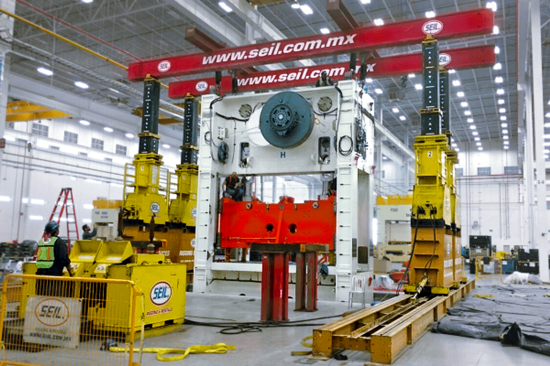 Assembly of 1,100 ton crown press using 500 ton hydraulic frame.